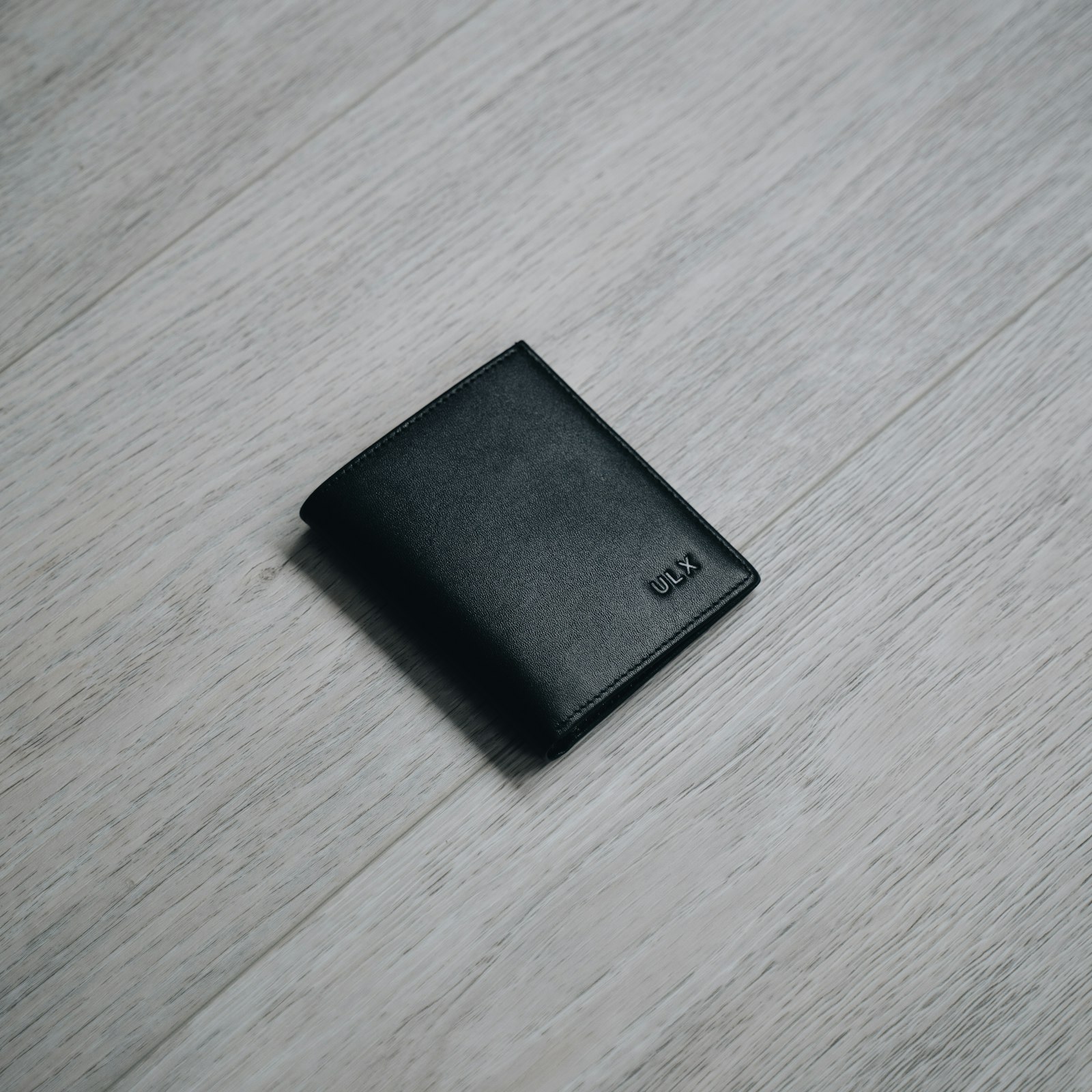 Minimalist black leather bifold wallet